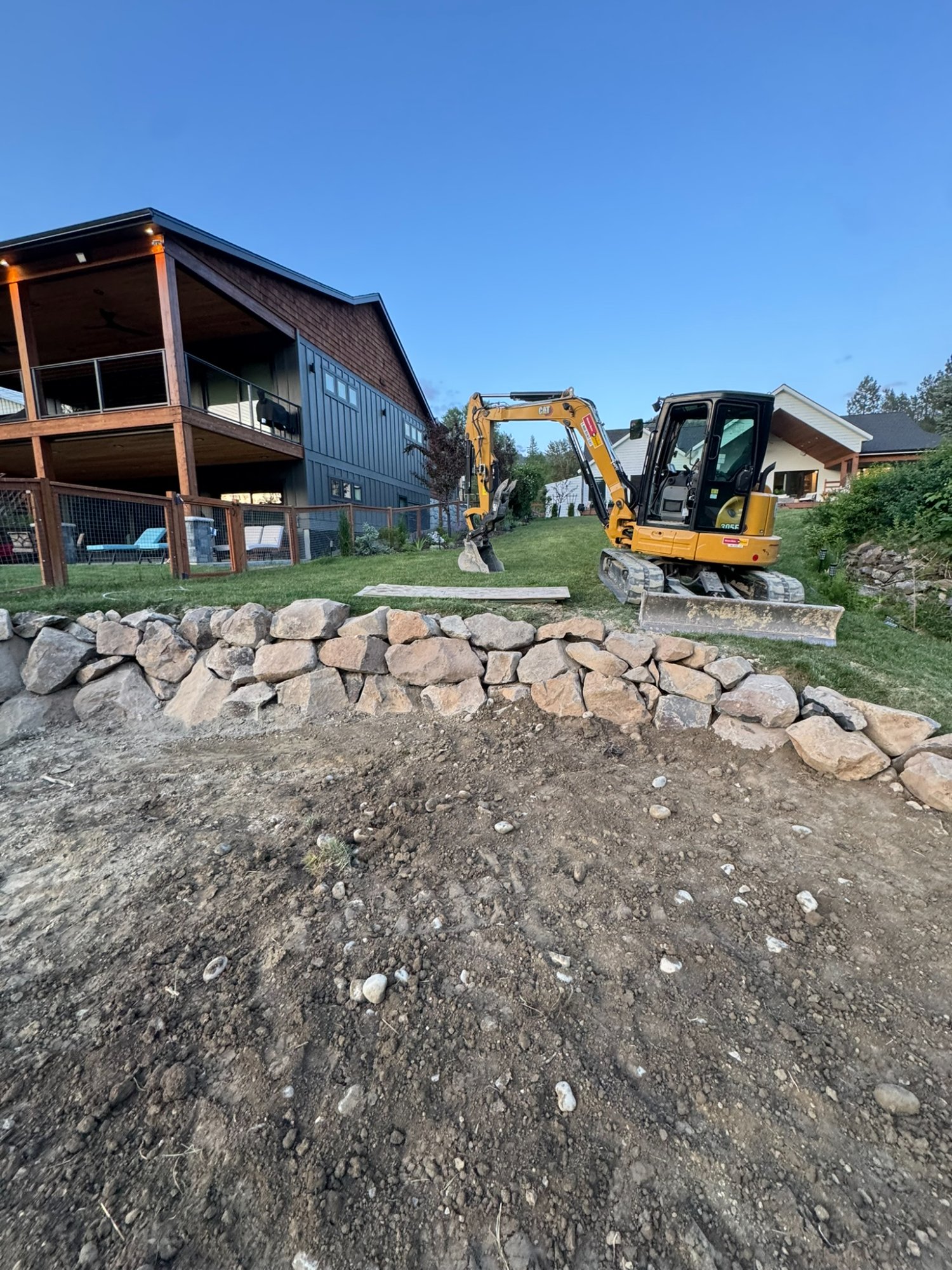 Elkry Construction crew installing underground tank on commercial street excavation in Coeur d'Alene