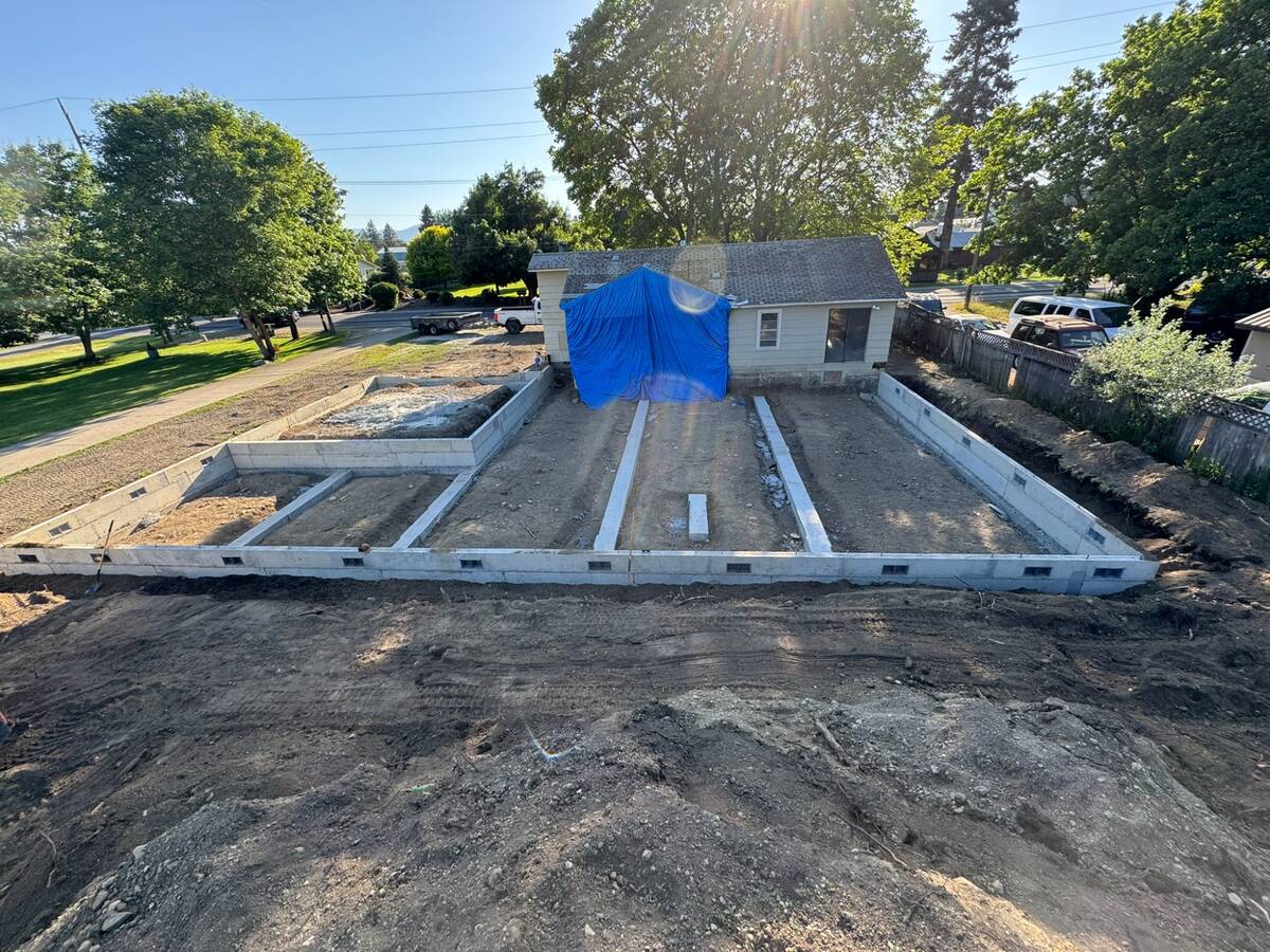 Aerial view of house foundation excavation and site preparation in Coeur d'Alene Idaho by Elkry Construction
