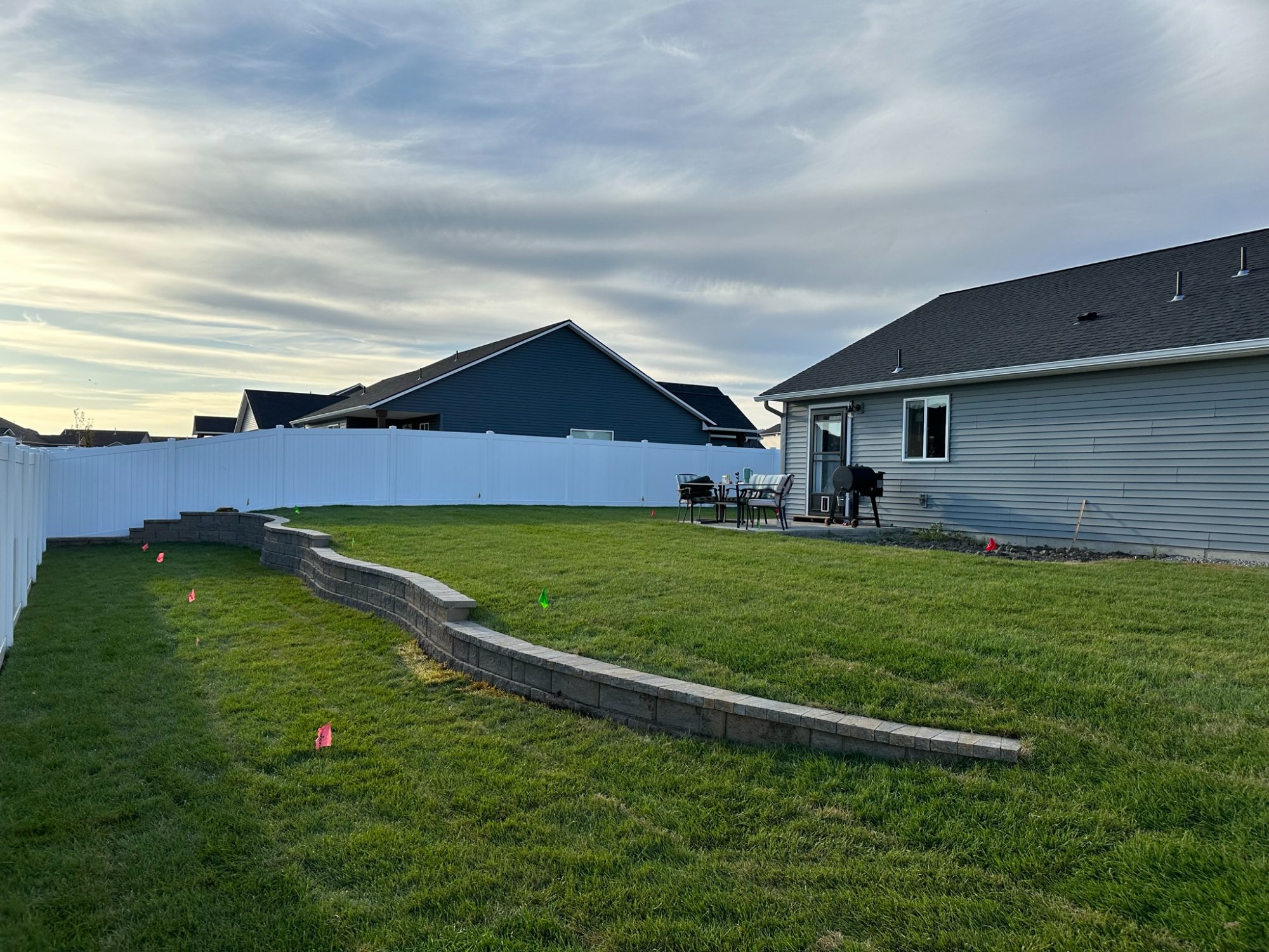 Custom stone steps leading down to Lake Coeur d'Alene with turquoise water and mountain views